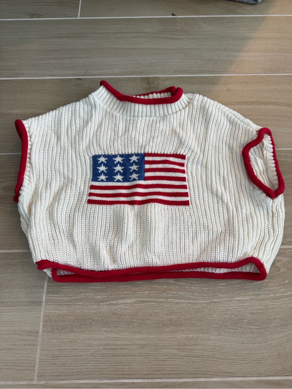 Cream Knit Sleeveless Sweater with Red Trim and Flag Motif
